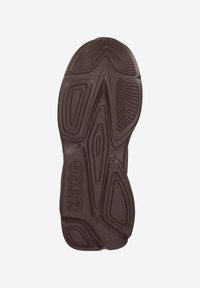 Brown rubber outsole with textured grooves and patterns, featuring the "HUGO" logo embossed on the side. Shapes include rounded and angular designs.