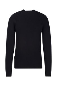 Schwarzer gerippter Pullover mit langen Ärmeln, Rundhalsausschnitt und seitlichem Reißverschluss. Das strukturierte Material betont Wärme und Komfort.