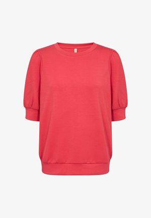 Korall színű, rövid ujjú felső, kerek nyakkivágással, rugalmas puffos ujjal és laza fazonnal. Puha anyag, sima textúrával.