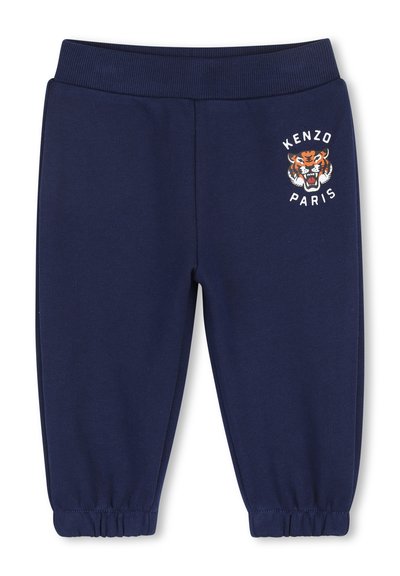 Pantaloni da jogging per bambini di colore blu navy con vita e polsini elasticizzati, caratterizzati da una grafica con testa di tigre e dal testo "Kenzo Paris" sulla coscia sinistra.