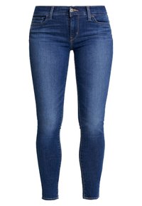 Mörkblå skinny jeans i denim, med en klassisk femficksdesign, bältesöljer och dragkedja med knappstängning.