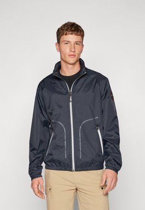 Giacca zip-up blu navy con colletto alto, polsini elasticizzati e due tasche laterali, caratterizzata da dettagli in piping bianco lungo la parte anteriore.