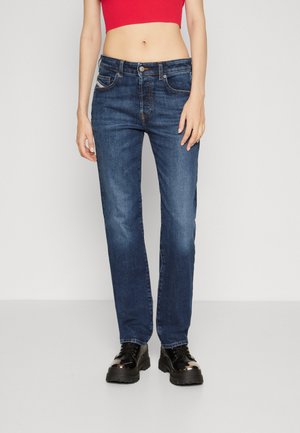 Dark blue denim jeans with a straight leg design, featuring five pockets, contrasting stitching, and a front button closure.