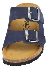 Navy blue suede sandal with two adjustable silver buckles, cork midsole, and textured black rubber sole. Soft brown footbed lining.