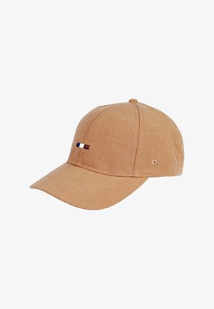 Brown cotton cap with a curved brim, featuring a small multi-colored striped accent on the front, stitched detailing, and ventilation holes.