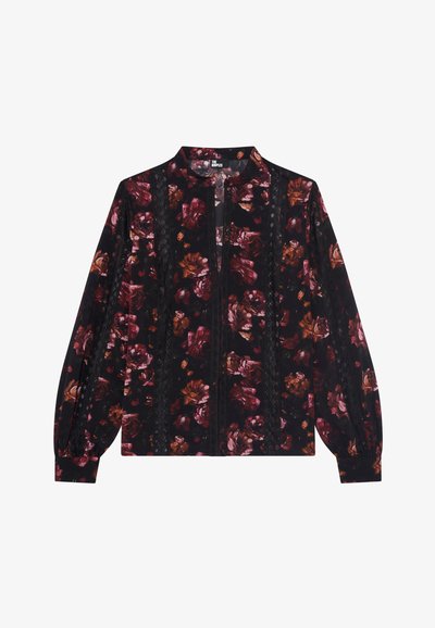 Blusa zip-up floreale nera con motivi di rose bordeaux e rosa. Presenta un colletto alto e maniche lunghe a sbuffo con dettagli in pizzo.