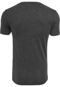 Short-sleeve t-shirt in dark gray, made of soft cotton blend, crew neck design, plain texture with no patterns or visible hardware.