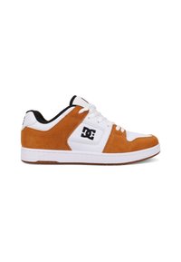 Sneakers with a white leather upper, orange suede accents, black lining, and a gum rubber sole. Features a prominent DC logo on the side.