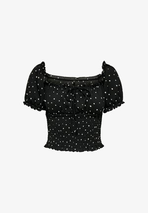 Mustat lyhyet hihaiset paidat valkoisilla pilkuilla, smockattu yläosa, neliön muotoinen kaula-aukko ja röyhelöreunat. Sisältää edessä olevan solmusiirtymän.