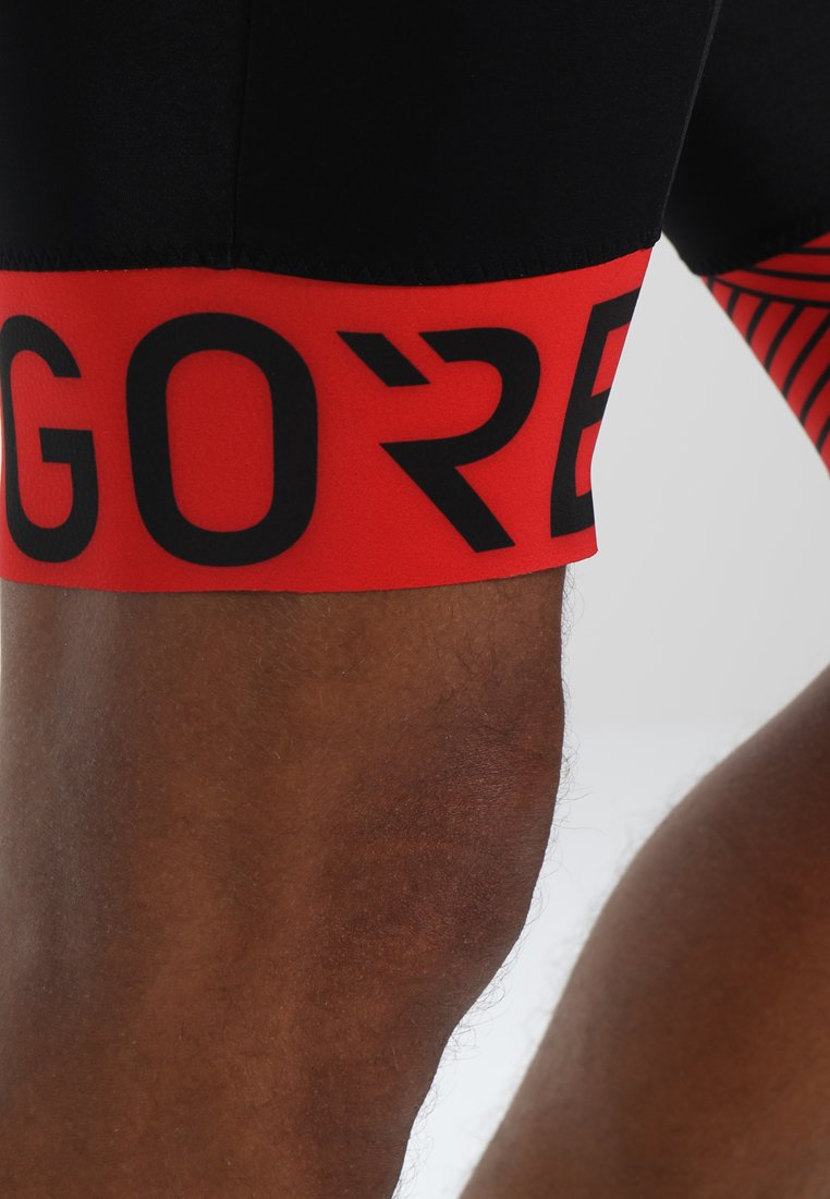 Herren Shirts | Gore Wear C5 OPTILINE KURZE TRÄGERHOSE Tights black/red/rot - QG28112 Herren Shirts | Gore Wear C5 OPTILINE KURZE TRÄGERHOSE Tights black/red/rot - QG28112