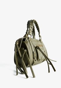 Olive green leather handbag with braided handles, zippered pocket, tassels, and gold-tone hardware. Textured finish with multiple accents.