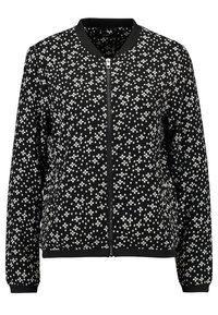 Blouson aviateur noir avec un motif floral blanc, poignets et col côtelés, et une fermeture éclair frontale. Tissu doux et texturé.