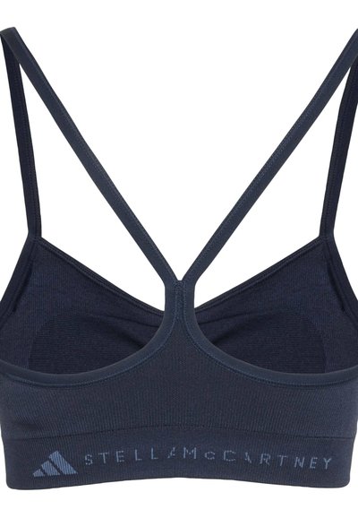 Navy blue sports bra with thin crossed shoulder straps and "Stella McCartney" branding on the bottom band.