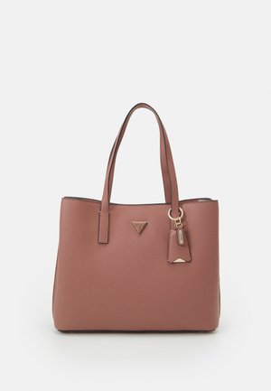 Brown leather tote bag with double handles and a small triangular metal logo plate on the front, featuring a hanging keychain accessory.