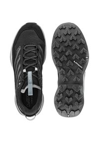 Scarpe da jogging nere con tomaia in rete, accenti grigi di supporto, suola in gomma testurizzata con tasselli multidirezionali per una migliore trazione.