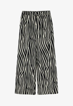 Laiad jalatsid musta ja kreemika zebra triibumustriga, elastne vöökoht koos nööriga ja küljetaskudega.