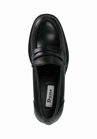 Black leather loafers with a smooth finish, featuring a raised piped design on the vamp and a flat sole. Lined interior with branding visible.