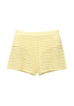 Gele gebreide shorts met een gestructureerd ontwerp en een ribband. De stof heeft een opengeweven patroon overal.