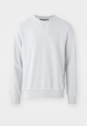 Light grey sweatshirt made from soft fabric, featuring a round neck, long sleeves, and ribbed cuffs and hem. Smooth texture with minimal design.