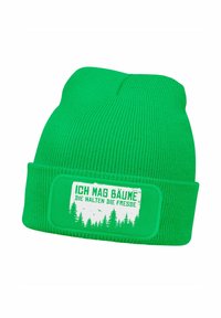 Green knitted beanie with ribbed texture. Front features a white rectangular patch with text and forest graphic. Bright color ensures visibility.