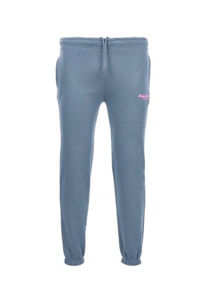 Pantalon de jogging bleu clair fabriqué en tissu en mélange de coton. Dispose d'une taille élastique avec cordon de serrage et d'un détail de logo rose sur la cuisse gauche.