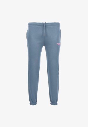 Pantalon de jogging bleu clair fabriqué en tissu en mélange de coton. Dispose d'une taille élastique avec cordon de serrage et d'un détail de logo rose sur la cuisse gauche.