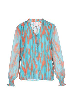 Blusa fluida a maniche lunghe di colore azzurro chiaro con motivo astratto arancione. Presenta un collo con cordoncino, chiusura a bottoni e polsini arricciati.