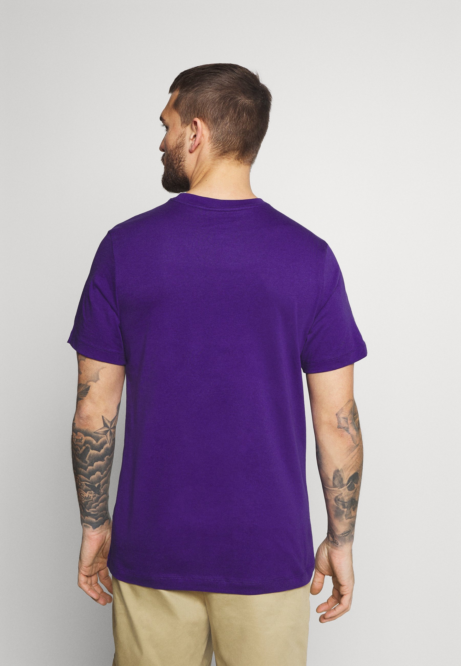 purple and turquoise nike shirt