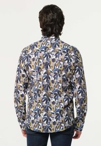 Lange mouwen shirt met een veelkleurig bloemenpatroon in marineblauw, olijfgroen en crème, gemaakt van lichtgewicht stof met knoopmanchetten.