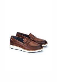 Bruine leren instapschoenen met een ronde neus, een beige tussenzool en decoratieve stikdetails op de wreef. Gladde textuur over het geheel.
