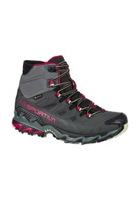 Scarpa da trekking grigia con dettagli rosa, tomaia strutturata, inserti in mesh nero e suola in gomma con tasselli per una migliore aderenza. Design impermeabile.