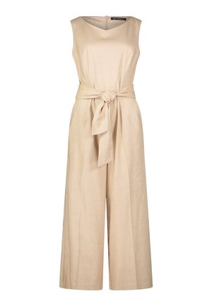 Salopette in lino beige con design senza maniche, taglio a gamba larga, dettaglio con cintura in vita e scollo a V. Presenta una cerniera discreta sulla schiena.