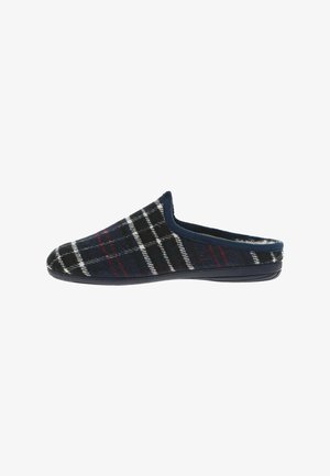 Chausson à carreaux avec un bout arrondi, en laine noire texturée avec des motifs rouges et blancs, doté d'une bordure bleu marine et d'une semelle en caoutchouc.