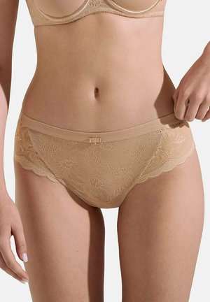 Slip - peau