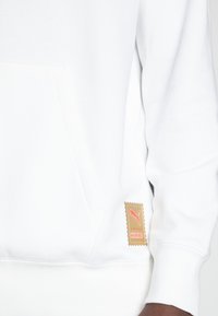 Puma PUMA HARIBO HOODIE - Sportinis megztinis - puma white