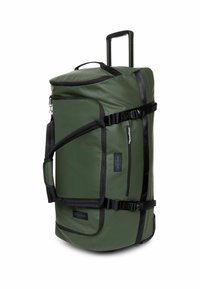 Grote groene duffelbag met uitschuifbare handgreep, zwarte accentbanden, zijvak en ritssluitingen. Gemaakt van duurzaam materiaal.