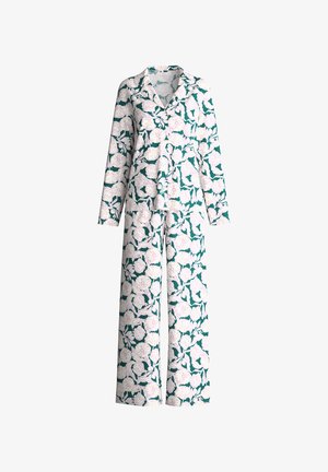Set pigiama con bottoni e maniche lunghe, con pantaloni a gamba larga, con sfondo verde e grande motivo floreale bianco.