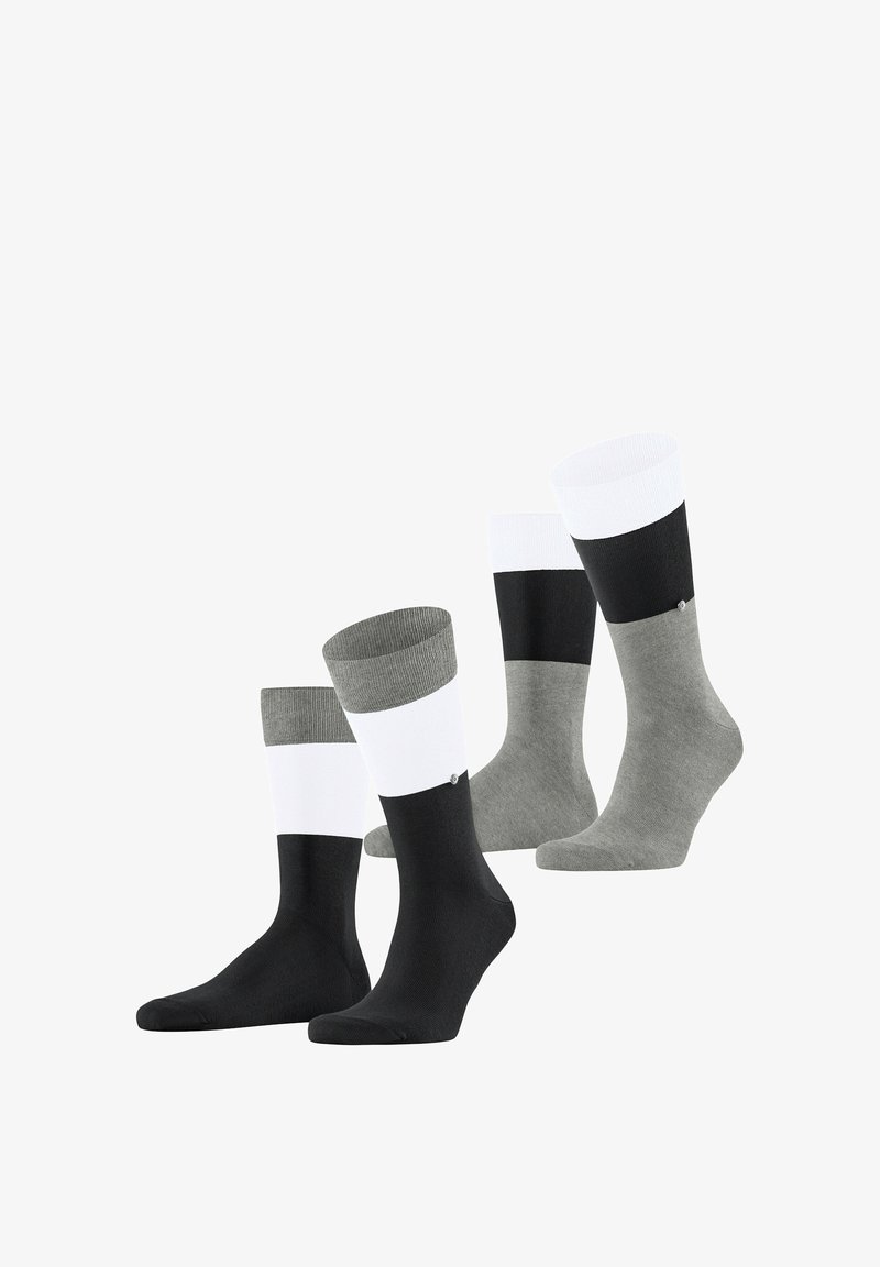 Quatre paires de chaussettes à bouts colorés en noir, blanc et nuances de gris, disposées en deux rangées sur un fond blanc.