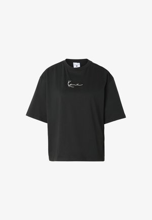 T-shirt noir oversize à manches courtes avec col rond et petit logo blanc en cursive centré sur la poitrine.