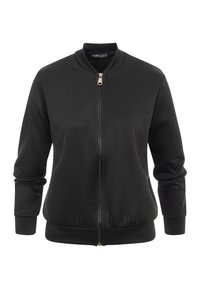 Veste bomber noire avec fermeture éclair frontale, col, poignets et ourlet côtelés, présentée sur un fond blanc.