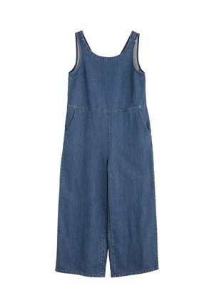 Keskmise sinise värvusega teksariidest kombinesoon, ilma varrukateta, kahe küljetaskuga, laia sääre disainiga ja õlal nööbiga kinnitamine.