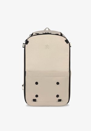 Beige fabric backpack with black accents. Features a zippered top, front pocket with snaps, and a minimalist logo on the front.