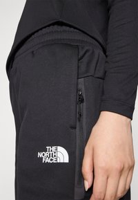 The North Face W MOUNTAIN ATHLETICS FLEECE PANT - Trainingsbroek - black