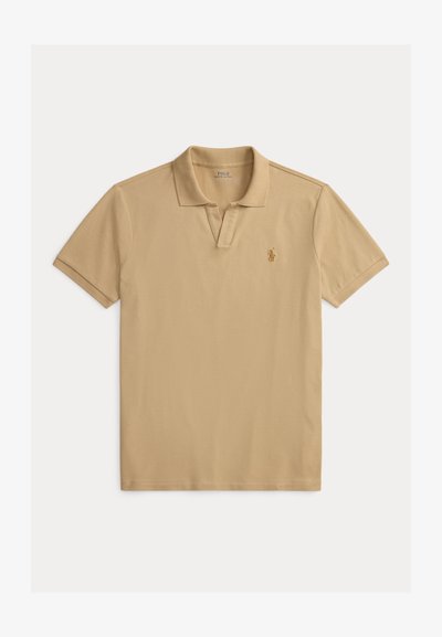 Beige polo shirt made from cotton, featuring a classic collar, short sleeves, and a small, embroidered logo on the left chest.