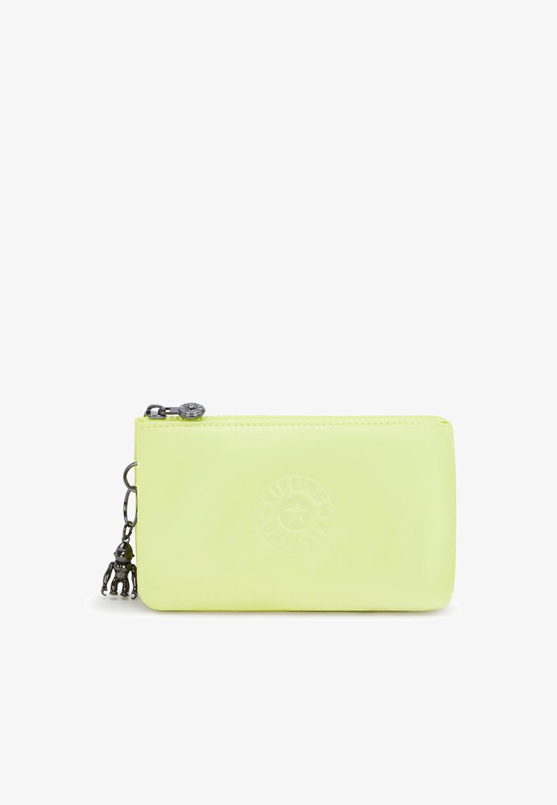 Light green rectangular zippered pouch with circular embossed logo and small silver monkey keychain attached to zipper pull.
