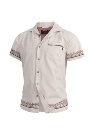Camicia a manica corta con bottoni di colore beige chiaro, realizzata in un tessuto texturizzato, con taschino sul petto e motivi decorativi sulle maniche e sull'orlo.