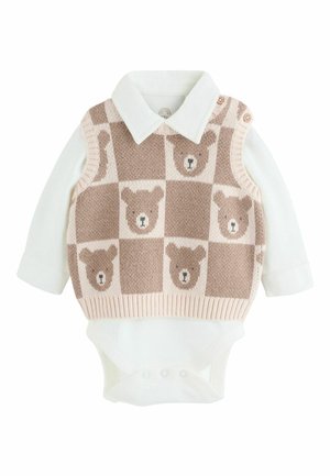 Knitted beige vest with teddy bear pattern over white long-sleeve bodysuit. Features button accents and ribbed edges.