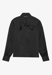 Black blouse with satin front and sheer, textured polka dot sleeves. Features a tied collar and buttoned cuffs for closure.
