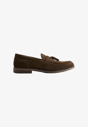 Brown suede loafer shoe with a rounded toe, small decorative bow accent, and a flat heel. Features stitched detailing along the upper.