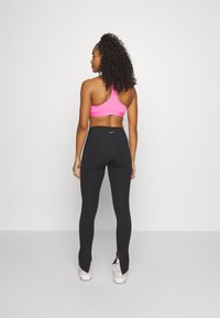 Nike Performance ONE SPLIT HEM - Leggings - black